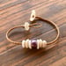 Image of Edison pearl and puka shells bracelet with locking seaglass clasp on hand braided sinew