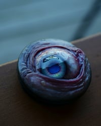 Image 10 of Custom Swappable Phone Grip for smartphones, bright blue reflective pupil, glow in the dark 