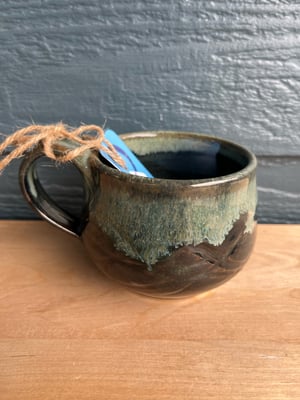 Image of M44 small mug with dark speckled glaze, round belly