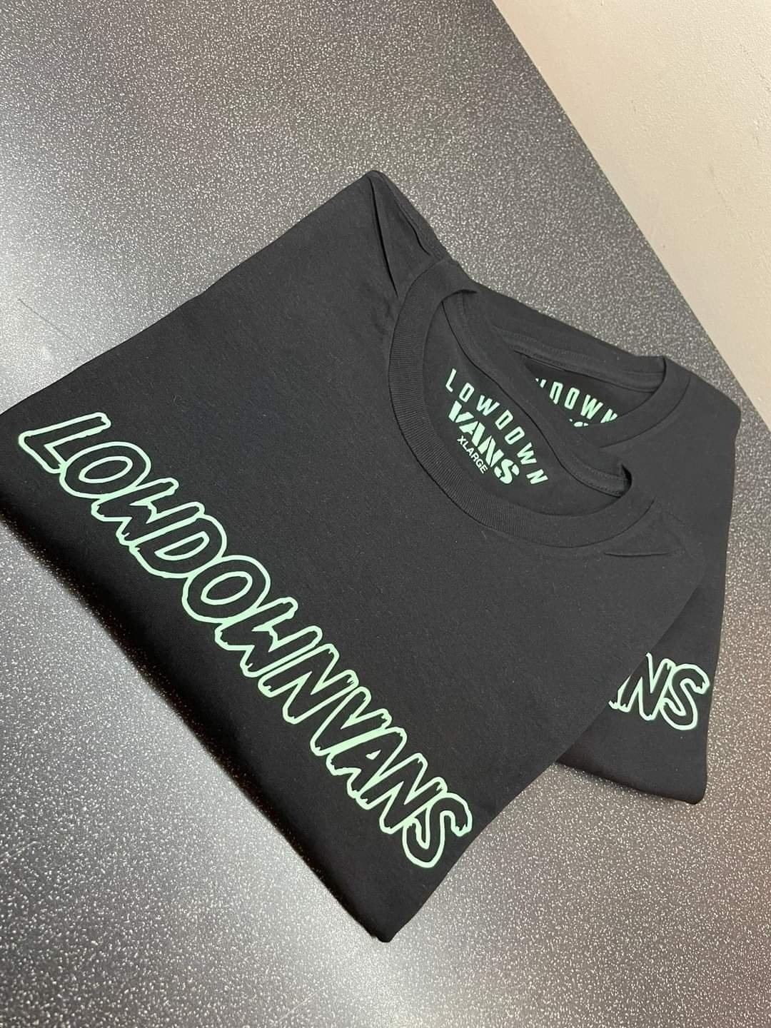 Image of lowdown vans t-shirt with outline writing on the front with ldv logo on the back 