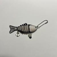 Image 2 of blue/purple glow in the dark skeleton fish keychain