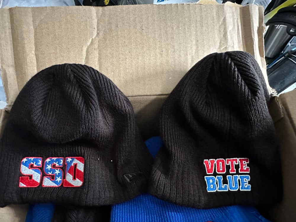 Black New Era SSD Democracy Knit Beanie with Rear “Vote Blue” logo