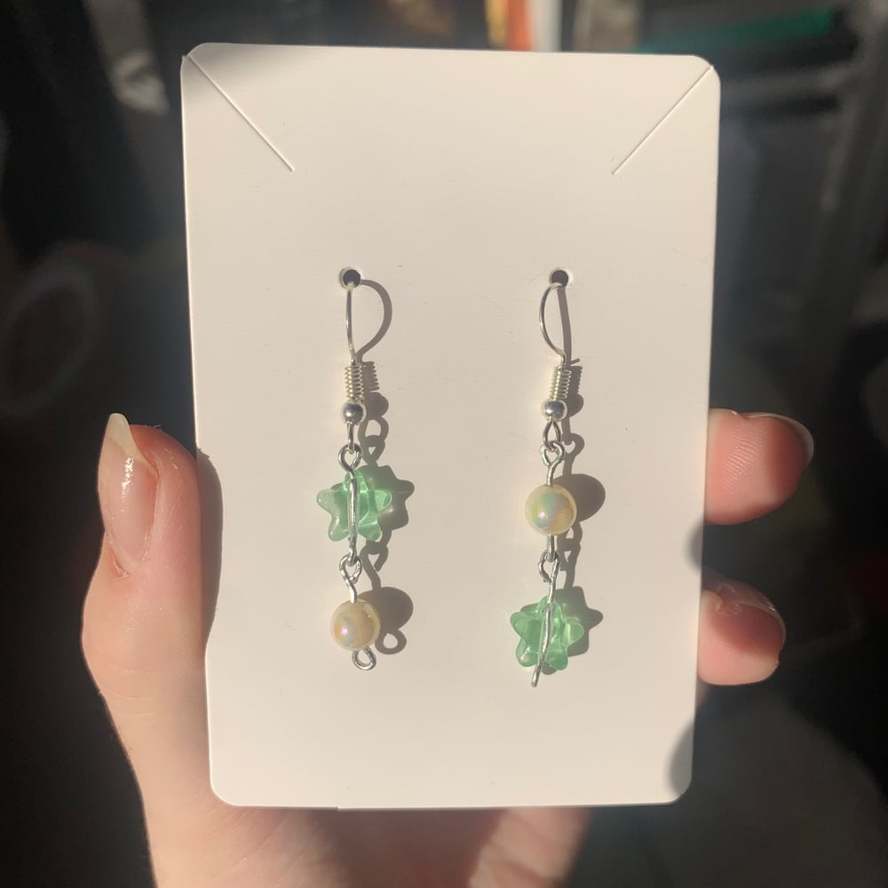 Image of green star earrings