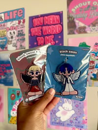 Image 1 of jimin and tae winged keychains.