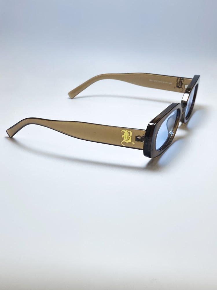 Image of BLE$$ING$®️ CLEAR BRN FRAMES / BLUE TINT