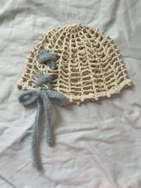 blue lace up beanie