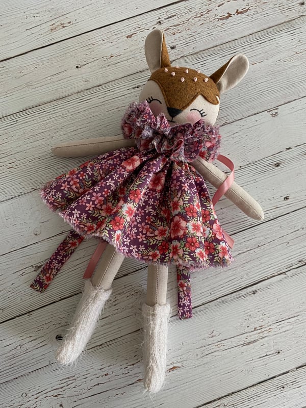 Image of Fawn, A Petite Forest Deer, With Flowered Dress And Neck Ruffle