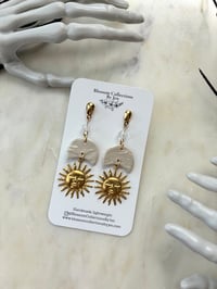 Image 1 of Moon and sun