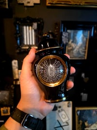 Image 1 of Black And Gold URN with Real Preserved Web -