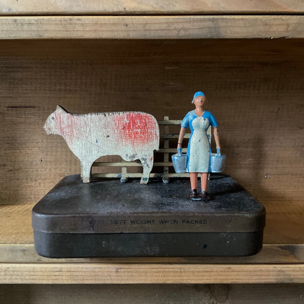 Image of Milkmaid,Cow,Fence & Tin