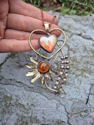 Heart pendant with orange flower
