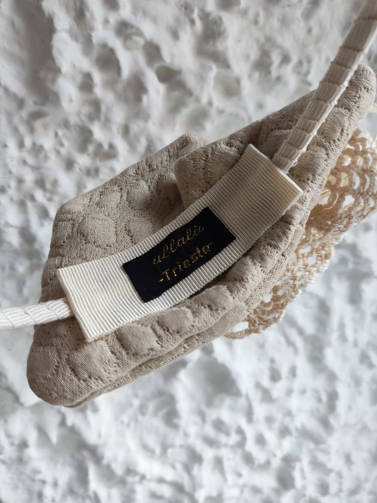 Image of Cerchietto uncinetto e fiocco avorio 