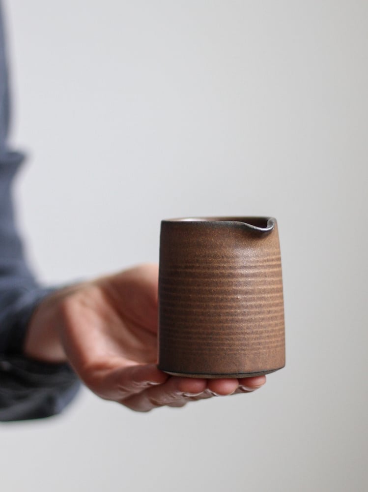 Image of small jug in textured tamba