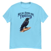 Image 1 of Trust Your Instincts Raven Unisex Graphic Tee – Gothic Raven & Hand Streetwear Design