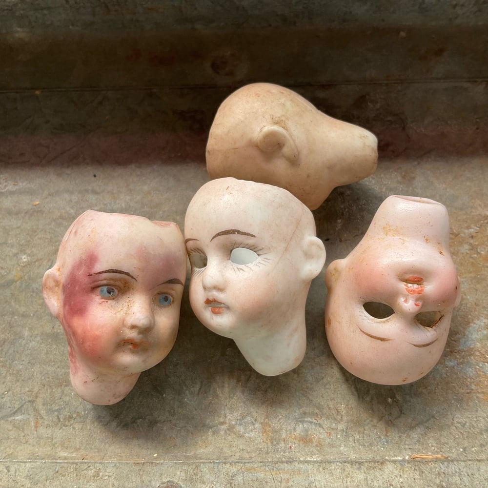 Image of Four Tiny Doll Heads