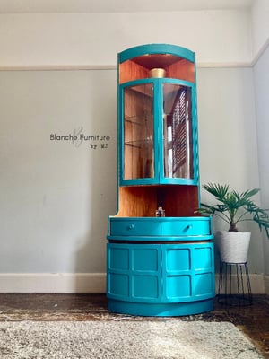 Image of Nathan Corner Drinks Cabinet unit with light in vibrant teal