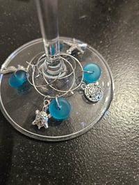 Image 1 of lagoon teal seaglass wine charms