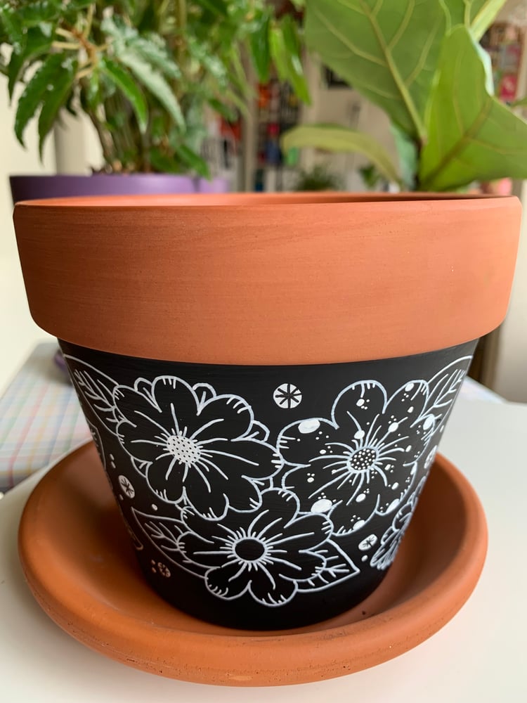 Image of "Black Flowers" terra cotta pot