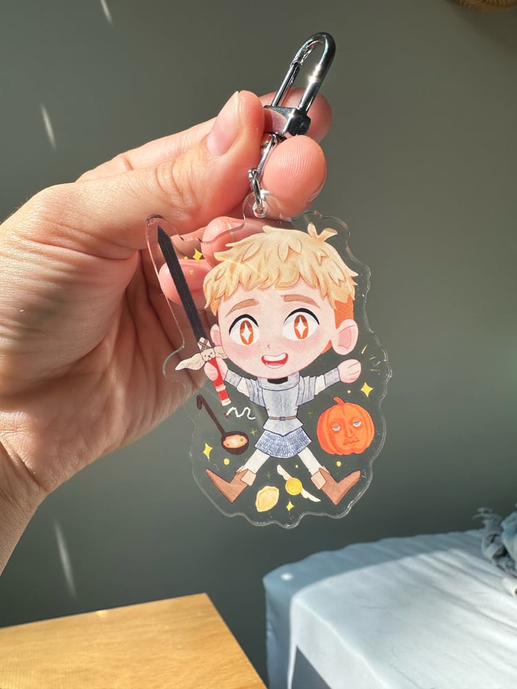 Image of Dungeon Meshi Laios Double Sided Acrylic Keychain 2.5”