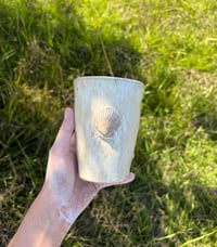 Image 1 of 12oz. Cream sea shell to go mug 