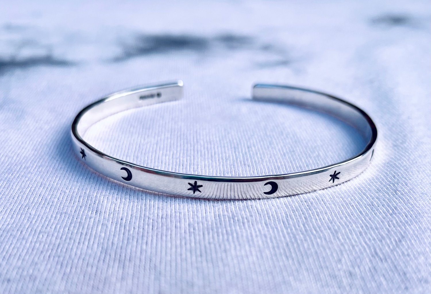 Image of Childrens/adults sterling silver star moon cuff bracelet (4mm wide). Celestial stamped silver cuff. 