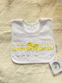 White & lemon frilly bibs 