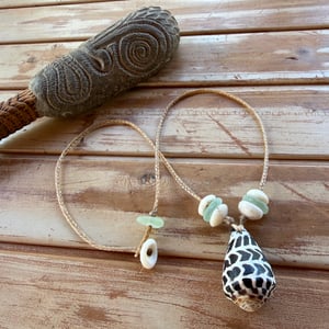 Image of Hawaiian Hebrew Cone Shell Necklace with Puka Shells and Sea Glass 
