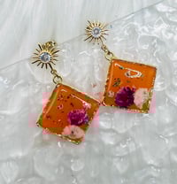 Image 1 of ORANGE STAR FLORAL DANGLES