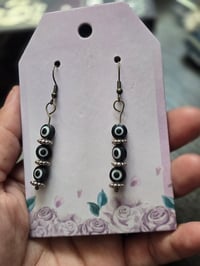 Black evil eye earrings