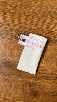 Image 2 of White and pink lighter/chapstick holder 