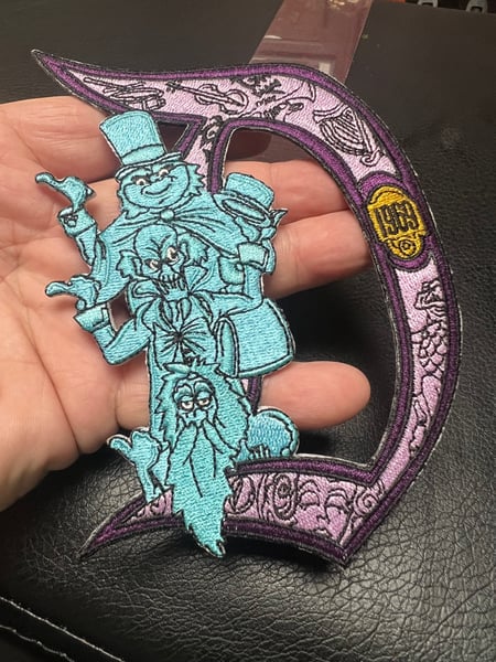 Image of 9” Haunted Mansion Disneyland “D” 1969 patch with iron on backing