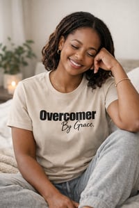 Image 1 of Overcomer By Grace Christian T-Shirt for Women | Faith-Based Motivational Shirt