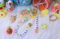 Image 1 of 'kiss later' LOONA keychain