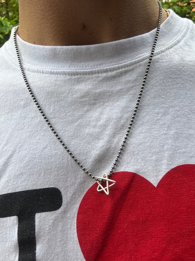 Image of mini venus star charm