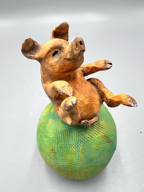 Image of In a world of chaos, the pig stands firm - Julie Kradel