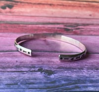 Image 2 of 'Luna' symbol stamped cuff bracelet. Slim silver Aztec patterned cuff bracelet. 