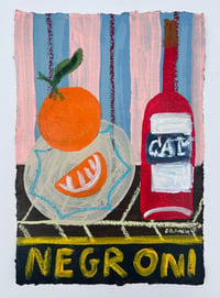 Negroni with orange on blue and pink stripes