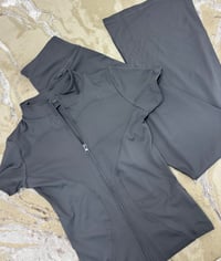 Image 3 of short sleeve zip flare gym set 
