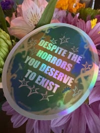 Image 3 of despite the horrors sticker