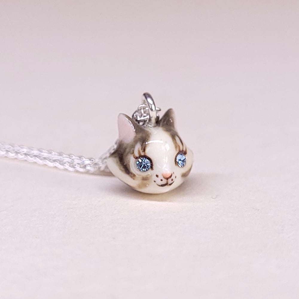 Image of Dilute Calico Porcelain & Sterling Silver Teeny Tiny Cat Pendant