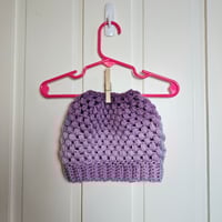 Image 1 of purple ponytail crocheted hat