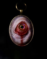 Image 8 of Color Shift Eye glow in the dark pendant OOAK