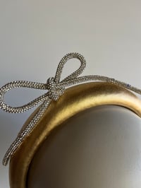 Image 2 of Gold padded headband w diamanté bow. 