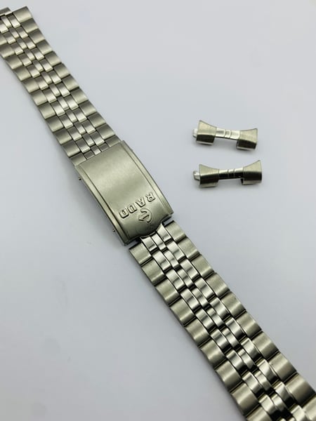 Image of rado stainless steel gents watch strap,band,bracelet new.1980's.curved lugs.19mm