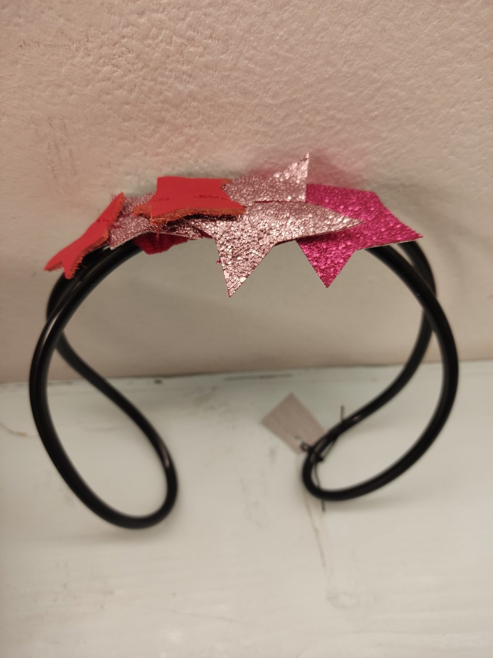 Image of Molly fascinator con stelle