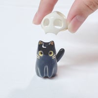 Image 1 of Glow In Dark Black Cat With Skull Mask ceramic Figurine