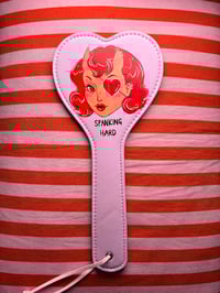 Image 2 of Devil lady spanking paddle
