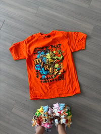 orange shirt (sz small)