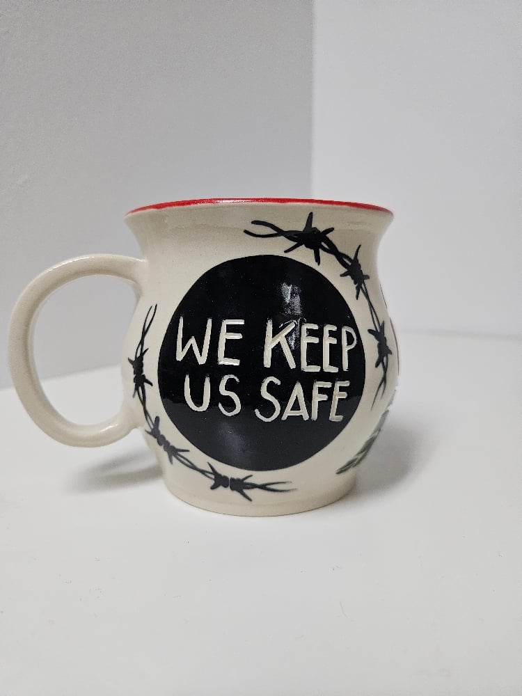 "we keep up safe" sword mug (7)