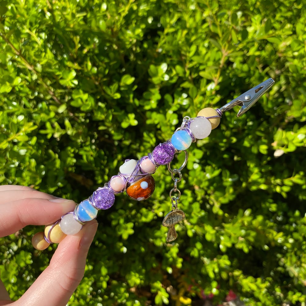 Image of pink shroom roach clip
